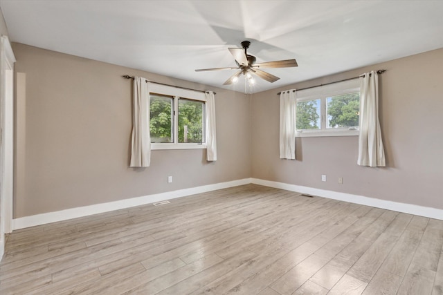 303 E Xy Ave, Vicksburg, MI 49097 - empty room with a ceiling fan, light wood-style floors, and baseboards