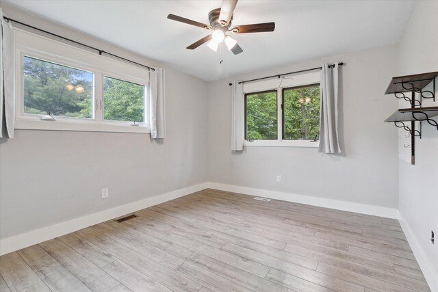 303 E Xy Ave, Vicksburg, MI 49097 - spare room with baseboards, ceiling fan, and wood finished floors