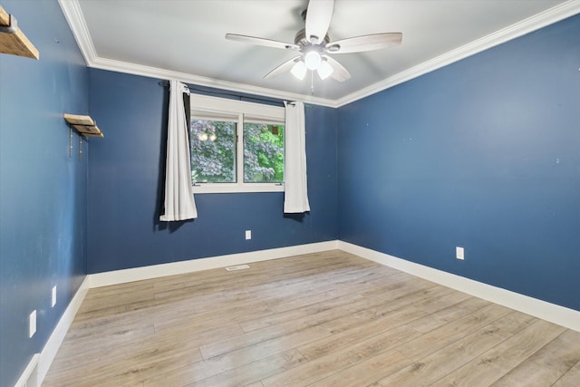 303 E Xy Ave, Vicksburg, MI 49097 - unfurnished room featuring ceiling fan, crown molding, wood finished floors, and baseboards