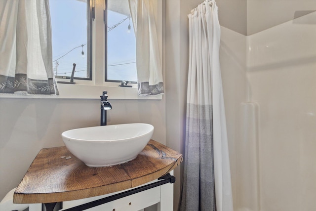 303 E Xy Ave, Vicksburg, MI 49097 - full bathroom featuring vanity and a shower with curtain