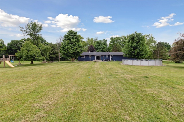 303 E Xy Ave, Vicksburg, MI 49097 - view of green lawn featuring an outdoor pool