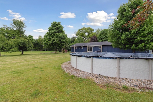303 E Xy Ave, Vicksburg, MI 49097 - view of grassy yard featuring a covered pool