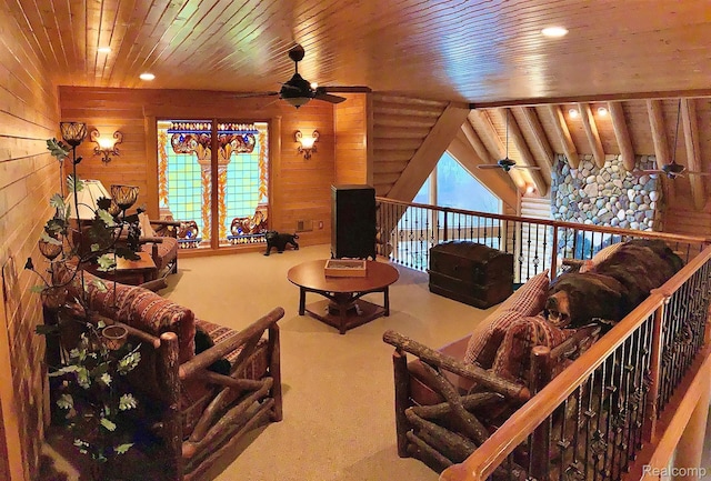 4143 Longview Dr, Lapeer, MI 48446 - living room featuring ceiling fan, wood ceiling, wood walls, carpet flooring, and plenty of natural light