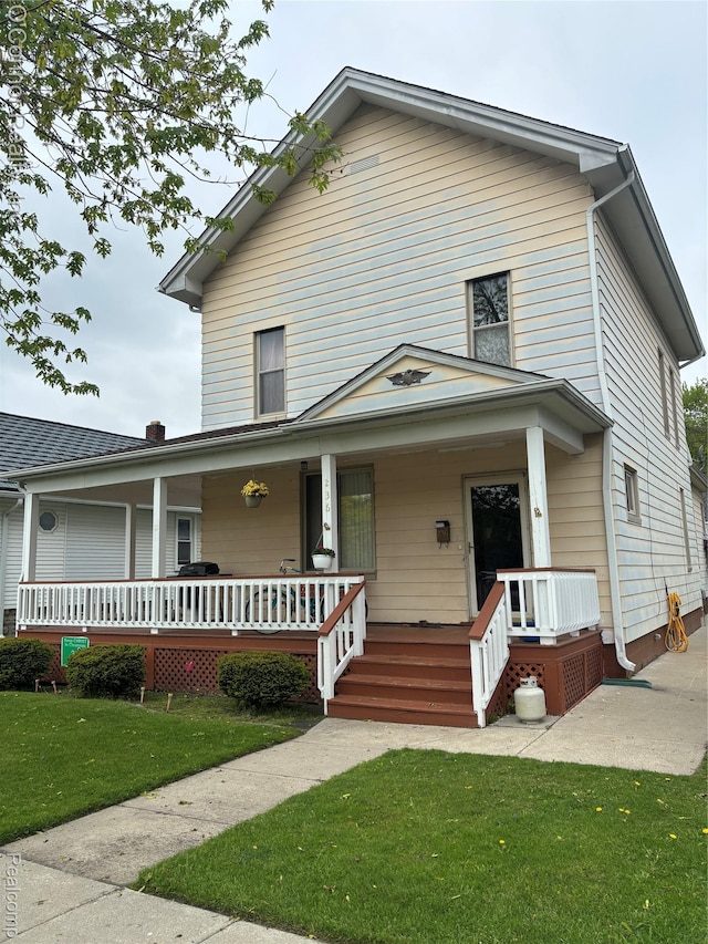 236 S Elizabeth St, Marine City, MI 48039 - view of front of home featuring covered porch and a front yard