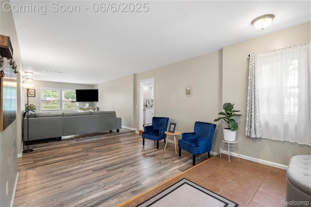 6226 Rowley Blvd, Waterford, MI 48329 - living area featuring wood finished floors and baseboards