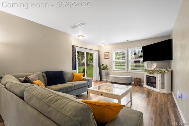 6226 Rowley Blvd, Waterford, MI 48329 - living area with wood finished floors, baseboards, and a fireplace