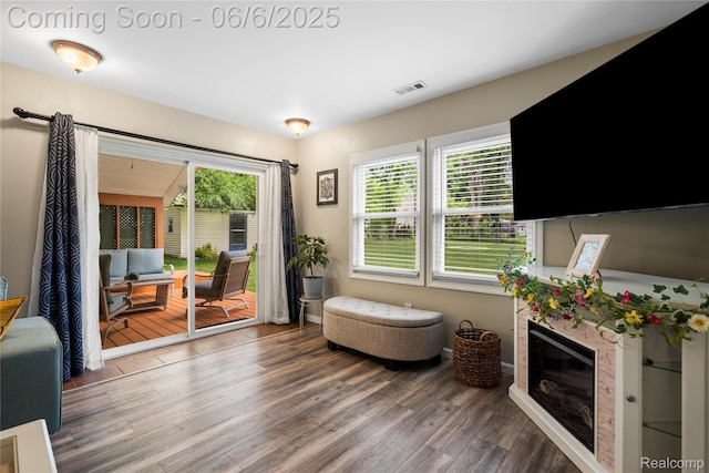 6226 Rowley Blvd, Waterford, MI 48329 - living area featuring wood finished floors and a premium fireplace