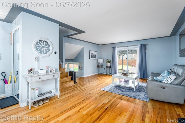 9744 Pere Ave, Livonia, MI 48150 - living area with stairs, wood finished floors, and baseboards