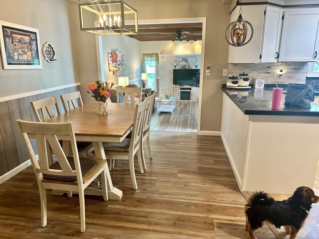 558 Terry St, Muskegon, MI 49442 - dining room with a chandelier and wood finished floors