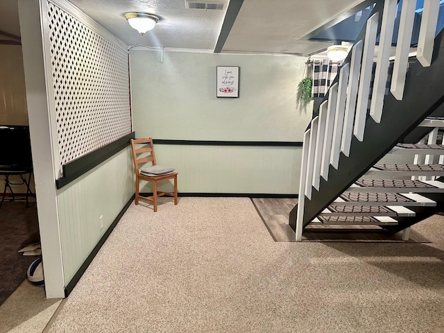 558 Terry St, Muskegon, MI 49442 - stairway featuring carpet flooring and wainscoting