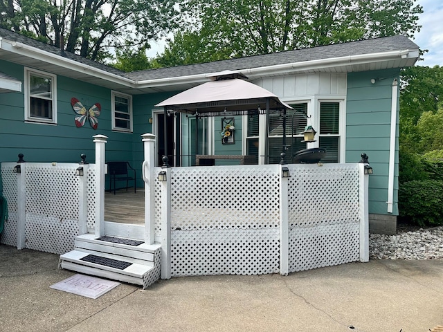 558 Terry St, Muskegon, MI 49442 - view of front of house featuring a gazebo and a shingled roof