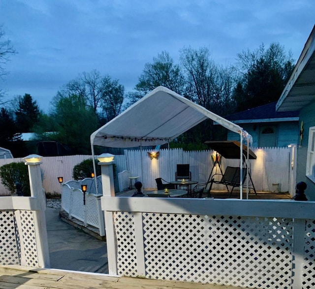 558 Terry St, Muskegon, MI 49442 - wooden deck with a fenced backyard and a patio area