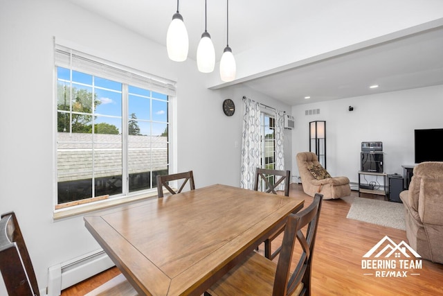 2203 Porter St SW Unit 104, Wyoming, MI 49519 - dining area featuring baseboard heating, light wood-style floors, recessed lighting, and a wall mounted AC