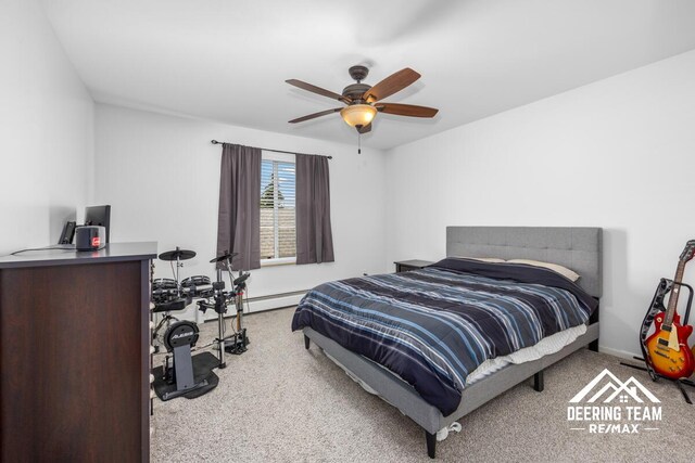 2203 Porter St SW Unit 104, Wyoming, MI 49519 - carpeted bedroom featuring baseboards, a baseboard radiator, and a ceiling fan