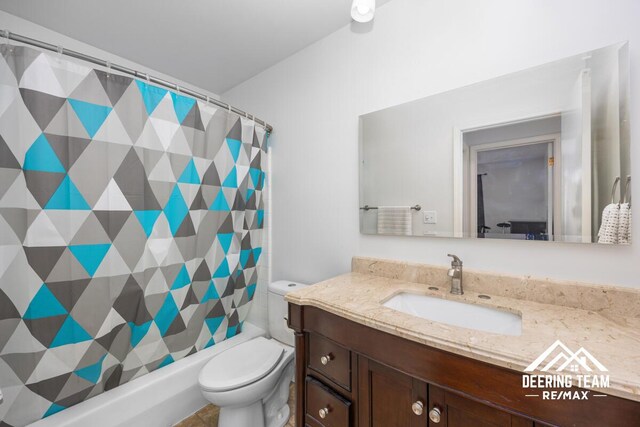 2203 Porter St SW Unit 104, Wyoming, MI 49519 - bathroom with vanity, toilet, and a shower with shower curtain