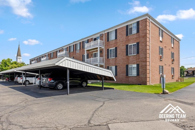 2203 Porter St SW Unit 104, Wyoming, MI 49519 - view of property featuring covered parking