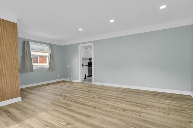 20241 Braile St, Detroit, MI 48219 - unfurnished room featuring baseboards, light wood-style flooring, and recessed lighting