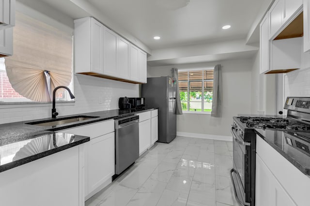 20241 Braile St, Detroit, MI 48219 - kitchen with appliances with stainless steel finishes, a sink, recessed lighting, baseboards, and tasteful backsplash