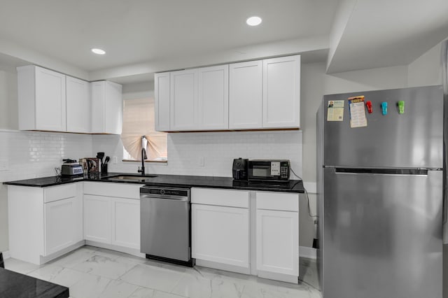 20241 Braile St, Detroit, MI 48219 - kitchen with stainless steel appliances, a sink, light marble finish floors, recessed lighting, and dark countertops
