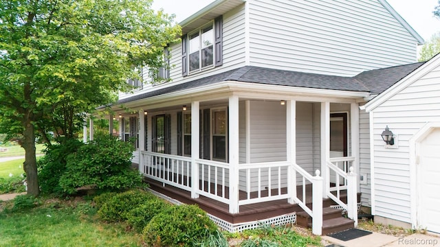 1755 Country View Dr, Okemos, MI 48864 - view of side of property with roof with shingles and covered porch