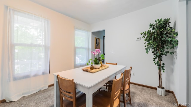 1755 Country View Dr, Okemos, MI 48864 - dining space with light carpet and baseboards