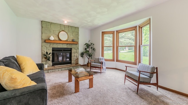 1755 Country View Dr, Okemos, MI 48864 - living area with carpet, baseboards, and a stone fireplace