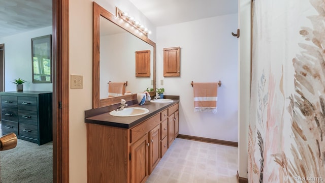 1755 Country View Dr, Okemos, MI 48864 - bathroom with double vanity and baseboards