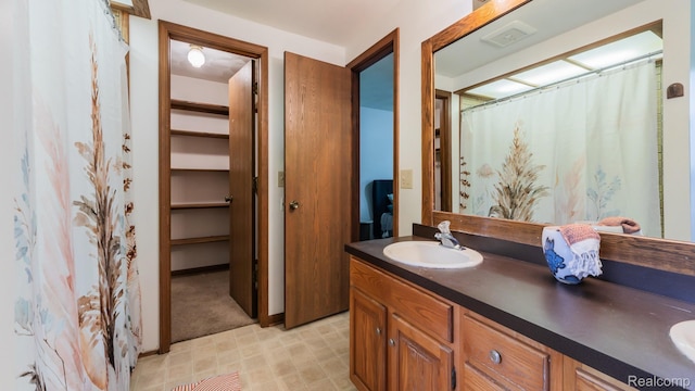 1755 Country View Dr, Okemos, MI 48864 - full bath featuring double vanity and tile patterned floors