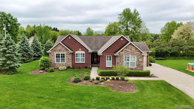 59649 Mallory Ln, South Lyon, MI 48178 - view of front of property featuring a front lawn, stone siding, concrete driveway, and a shingled roof