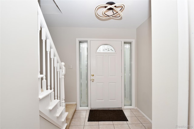 6835 Limerick Ln, Troy, MI 48098 - entrance foyer with stairs, light tile patterned floors, and baseboards