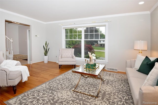 6835 Limerick Ln, Troy, MI 48098 - living area with wood finished floors, stairway, and crown molding