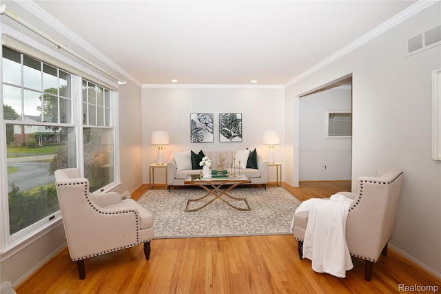6835 Limerick Ln, Troy, MI 48098 - living area featuring light wood-type flooring, crown molding, baseboards, and recessed lighting