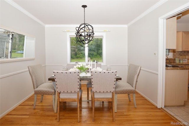 6835 Limerick Ln, Troy, MI 48098 - dining area featuring a chandelier, light wood finished floors, ornamental molding, and baseboards