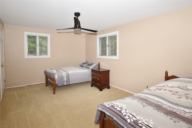 6835 Limerick Ln, Troy, MI 48098 - bedroom featuring multiple windows, light carpet, baseboards, and a ceiling fan
