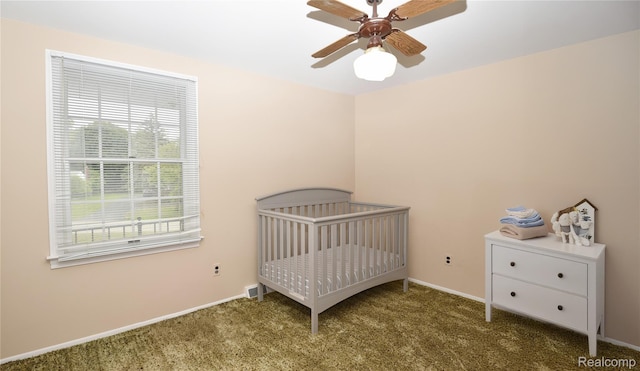 6835 Limerick Ln, Troy, MI 48098 - bedroom with carpet, a nursery area, baseboards, and ceiling fan