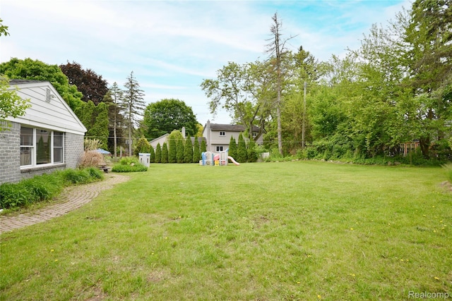 6835 Limerick Ln, Troy, MI 48098 - view of grassy yard with a playground