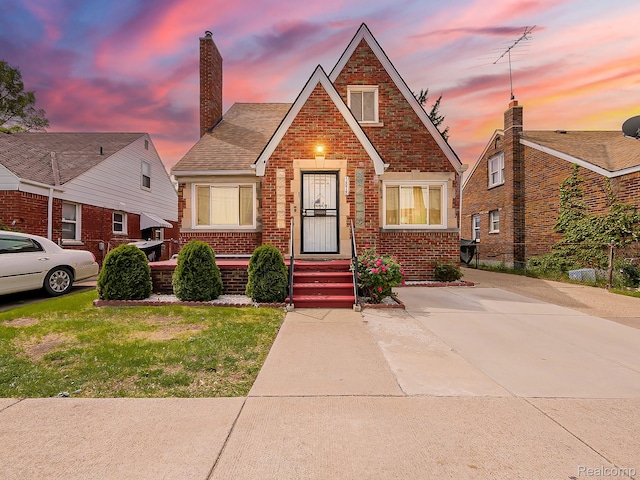 3878 Charles St, Hamtramck, MI 48212 - view of front of house with brick siding and a chimney