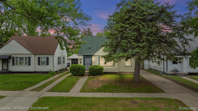 19020 Shiawassee Dr, Detroit, MI 48219 - view of front of property featuring concrete driveway, a lawn, and a shingled roof