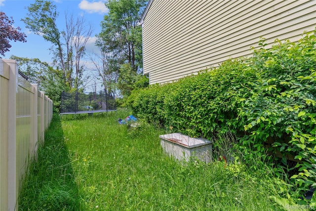 54319 Bradshaw Dr, New Baltimore, MI 48047 - view of yard with a trampoline