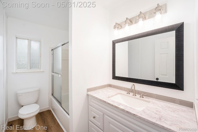 2809 Sparta Dr, Troy, MI 48083 - full bath featuring vanity, toilet, wood finished floors, and enclosed tub / shower combo