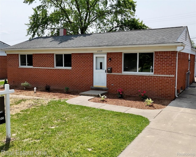 2809 Sparta Dr, Troy, MI 48083 - view of front of house with brick siding, a front lawn, a shingled roof, and a chimney