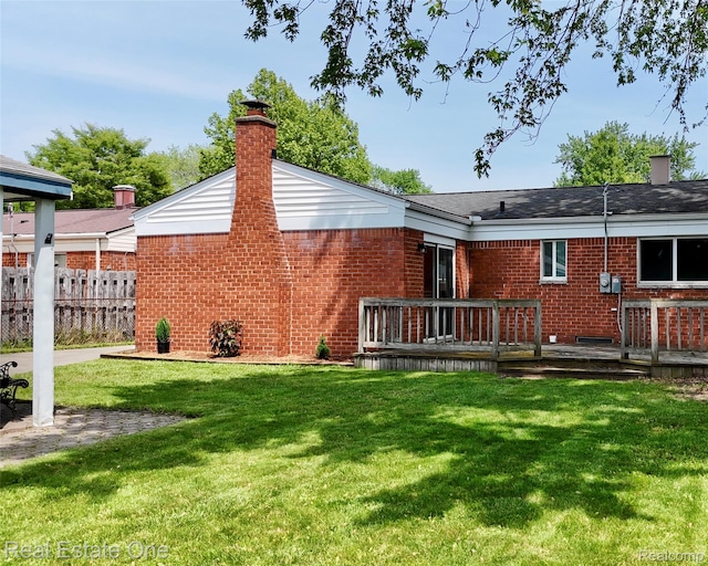 2809 Sparta Dr, Troy, MI 48083 - back of property with brick siding, a wooden deck, and a chimney