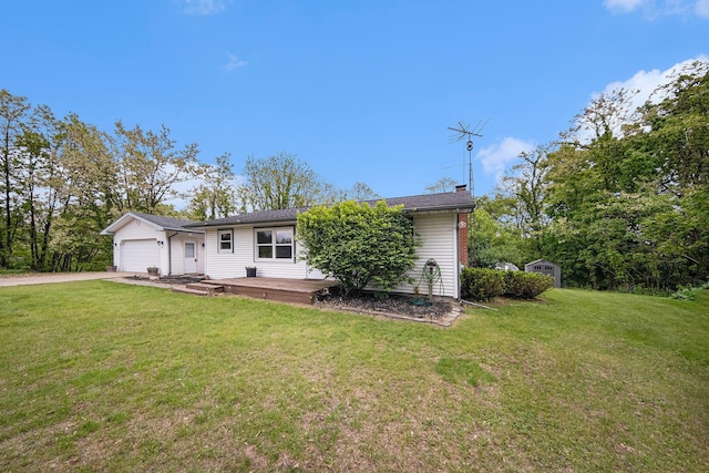 3225 Fishville Rd, Grass Lake, MI 49240 - view of front of house with a garage, a front yard, and driveway