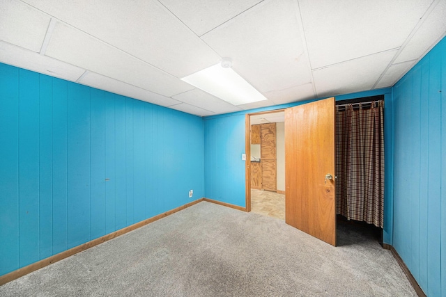 3225 Fishville Rd, Grass Lake, MI 49240 - unfurnished bedroom with carpet and wood walls