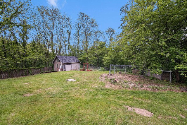 3225 Fishville Rd, Grass Lake, MI 49240 - view of yard featuring a garage and an outdoor structure