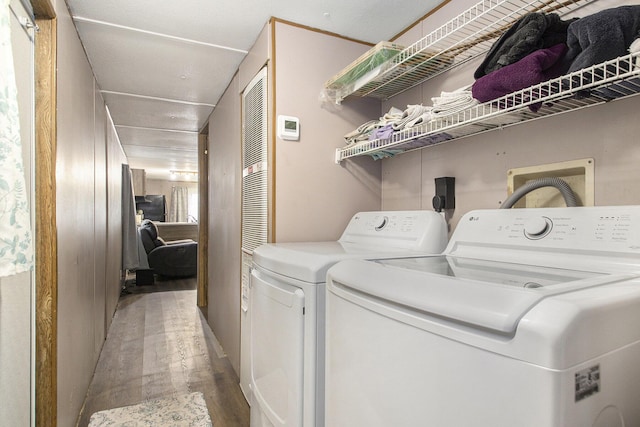 24923 Sandy Beach Dr, Edwardsburg, MI 49112 - washroom featuring washer and clothes dryer and light wood-style floors
