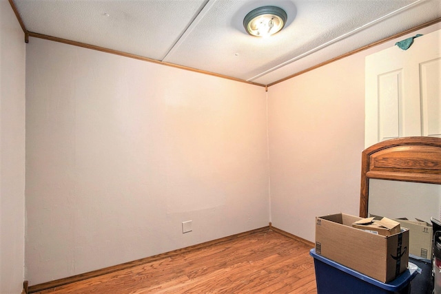 24923 Sandy Beach Dr, Edwardsburg, MI 49112 - unfurnished room featuring light wood-style flooring and crown molding