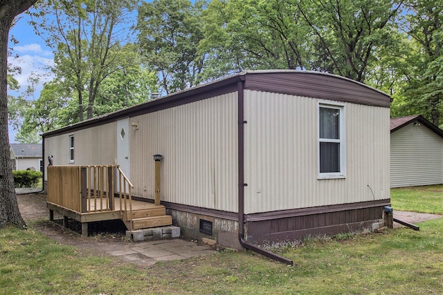 24923 Sandy Beach Dr, Edwardsburg, MI 49112 - back of house with a deck and a yard