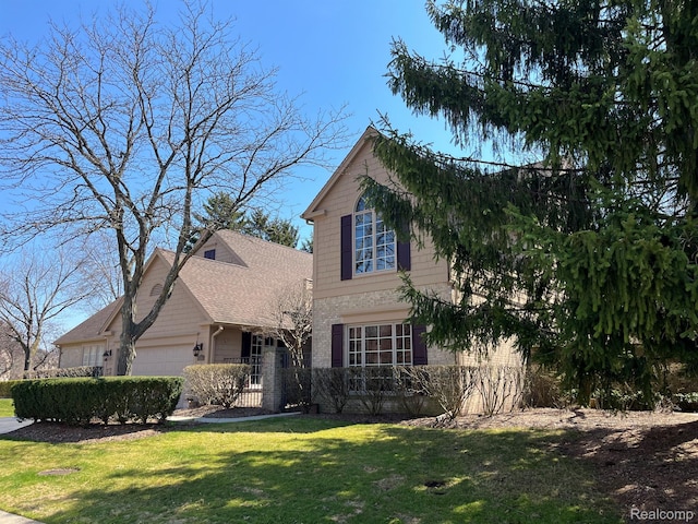 536 Cambridge Way, Bloomfield Hills, MI 48304 - view of front of home with a garage and a front yard