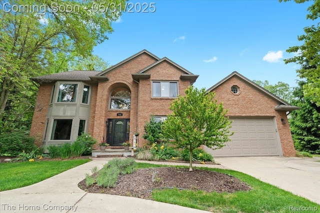 5182 Shady Creek Dr, Troy, MI 48085 - traditional home featuring driveway, brick siding, and an attached garage